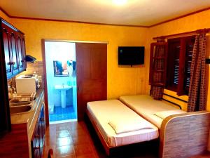 TV a/nebo společenská místnost v ubytování Sunrise Apartments