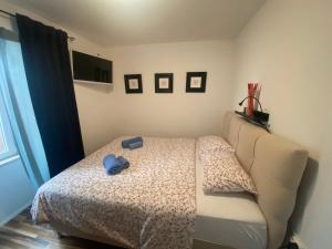 Postel nebo postele na pokoji v ubytování Apartman Volosko