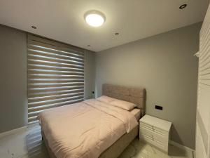 Postel nebo postele na pokoji v ubytování Square Light Residence