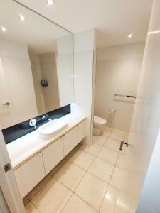 a bathroom with a sink and a toilet at Cscape3 in Cowes