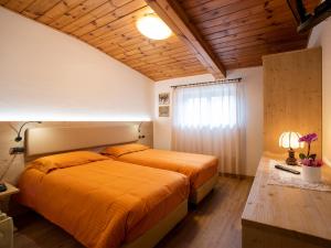 Voodi või voodid majutusasutuse Hotel Adriana toas