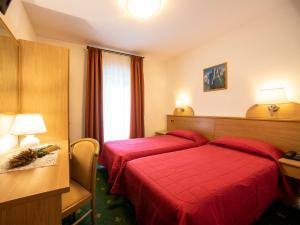 Voodi või voodid majutusasutuse Hotel Adriana toas
