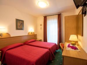 Voodi või voodid majutusasutuse Hotel Adriana toas