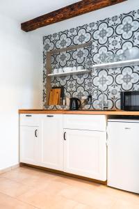 Kuchyň nebo kuchyňský kout v ubytování Apartmány Pulgary