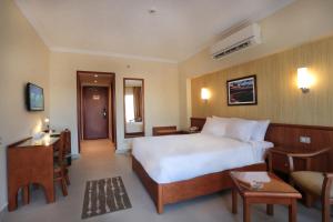 Postel nebo postele na pokoji v ubytování The Grand Plaza Hotel Smouha + 37 fotografií