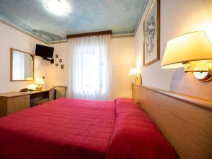 Voodi või voodid majutusasutuse Hotel Adriana toas