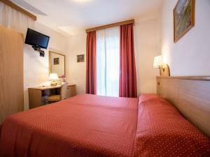 Voodi või voodid majutusasutuse Hotel Adriana toas