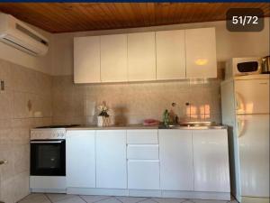 Kuchyň nebo kuchyňský kout v ubytování Apartment Meri
