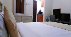 Postel nebo postele na pokoji v ubytování Al Khaleej Plaza Furnished Apartments LLC