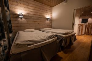 Posteľ alebo postele v izbe v ubytovaní Ranua Resort Holiday Villas