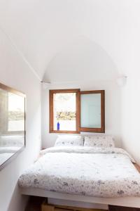 Voodi või voodid majutusasutuse Dammuso KeruKli' L'attico sulla Tunisia toas