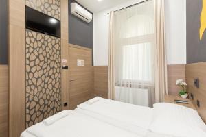 Postel nebo postele na pokoji v ubytování E14 Design Hostel