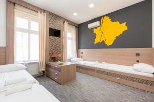 Postel nebo postele na pokoji v ubytování E14 Design Hostel