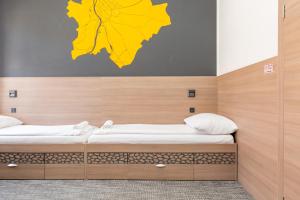 Postel nebo postele na pokoji v ubytování E14 Design Hostel