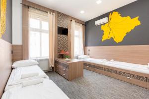 Postel nebo postele na pokoji v ubytování E14 Design Hostel