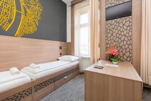 Postel nebo postele na pokoji v ubytování E14 Design Hostel