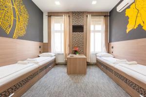 Postel nebo postele na pokoji v ubytování E14 Design Hostel