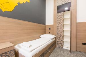 Postel nebo postele na pokoji v ubytování E14 Design Hostel