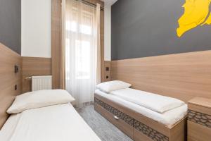 Postel nebo postele na pokoji v ubytování E14 Design Hostel