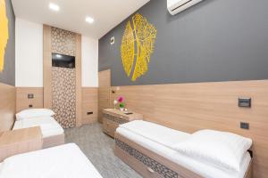 Postel nebo postele na pokoji v ubytování E14 Design Hostel