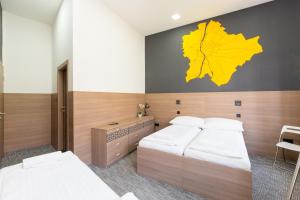 Postel nebo postele na pokoji v ubytování E14 Design Hostel