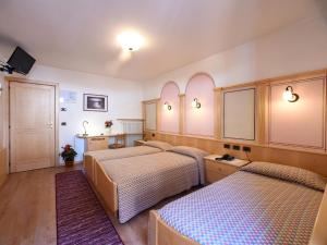 Voodi või voodid majutusasutuse Hotel Adriana toas