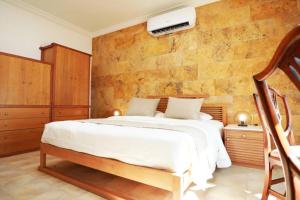 Una cama o camas en una habitación de Villa Sea Breeze