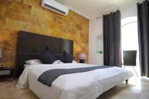 Una cama o camas en una habitación de Villa Sea Breeze