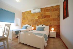 Säng eller sängar i ett rum på Villa Sea Breeze