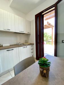 Kuchyň nebo kuchyňský kout v ubytování Villa Elia - Tenuta Le Scerze - Salento Homes + 37 fotografií