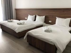 Postel nebo postele na pokoji v ubytování Hotel Dardani