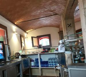 a kitchen with alot of dishes on the shelves at AGRITURISMO AZIENDA AGRICOLA FERRARI M.RITA in Pozza +21 photos