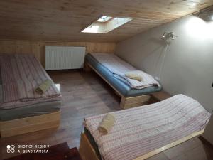 A bed or beds in a room at Nyírfás Camping