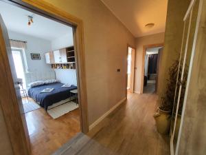 a view of a bedroom with a bed and a mirror at Apartment Sara in Umag