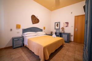 Postel nebo postele na pokoji v ubytování Hotel Costa D'Oro