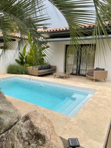 a swimming pool in front of a house at Casa Di l'Ortu in Ajaccio