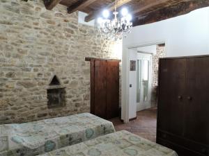 Postel nebo postele na pokoji v ubytování Non ditelo al Duca - Belvedere Sant'Angelo