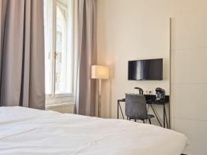 Ένα ή περισσότερα κρεβάτια σε δωμάτιο στο Pension Mozart - Newly Renovated