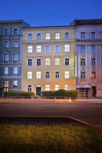 a large building on the side of a street at Prague Season Hotel in Prague