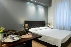 Postel nebo postele na pokoji v ubytování Relais La Torre