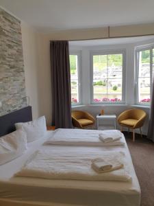 Postel nebo postele na pokoji v ubytování Haus Burgfrieden Cochem