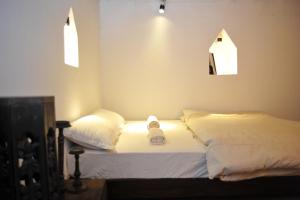 Letto o letti in una camera di Peacock Guest House