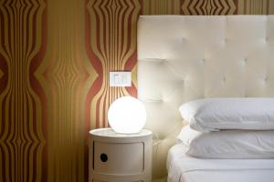 Postel nebo postele na pokoji v ubytování Relais La Torre