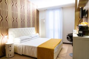 Postel nebo postele na pokoji v ubytování Relais La Torre