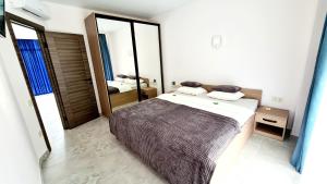 En eller flere senge i et værelse på BUGAZ GOLD апартаменти біля моря