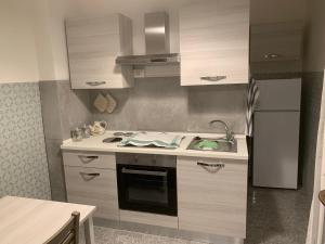 Kjøkken eller kjøkkenkrok på Ladispoli Suite
