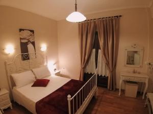 מיטה או מיטות בחדר ב-Hotel Mitikas