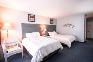 Postel nebo postele na pokoji v ubytování Scenic Inn