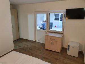 Μια τηλεόραση ή/και κέντρο ψυχαγωγίας στο EVANA HOUSE