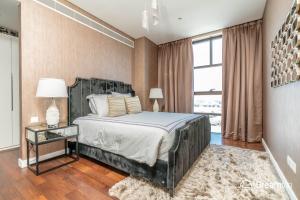 เตียงในห้องที่ Dream Inn Apartments - City Walk Prime